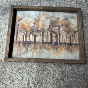 Forest scene painting. Brown wooden frame.
